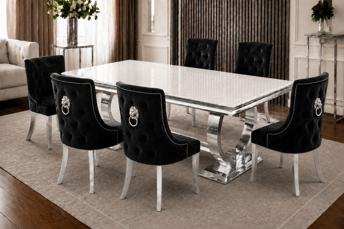 A modern Lewis Verona gold marble dining set with 4 beige velvet lion-knocker chairs.